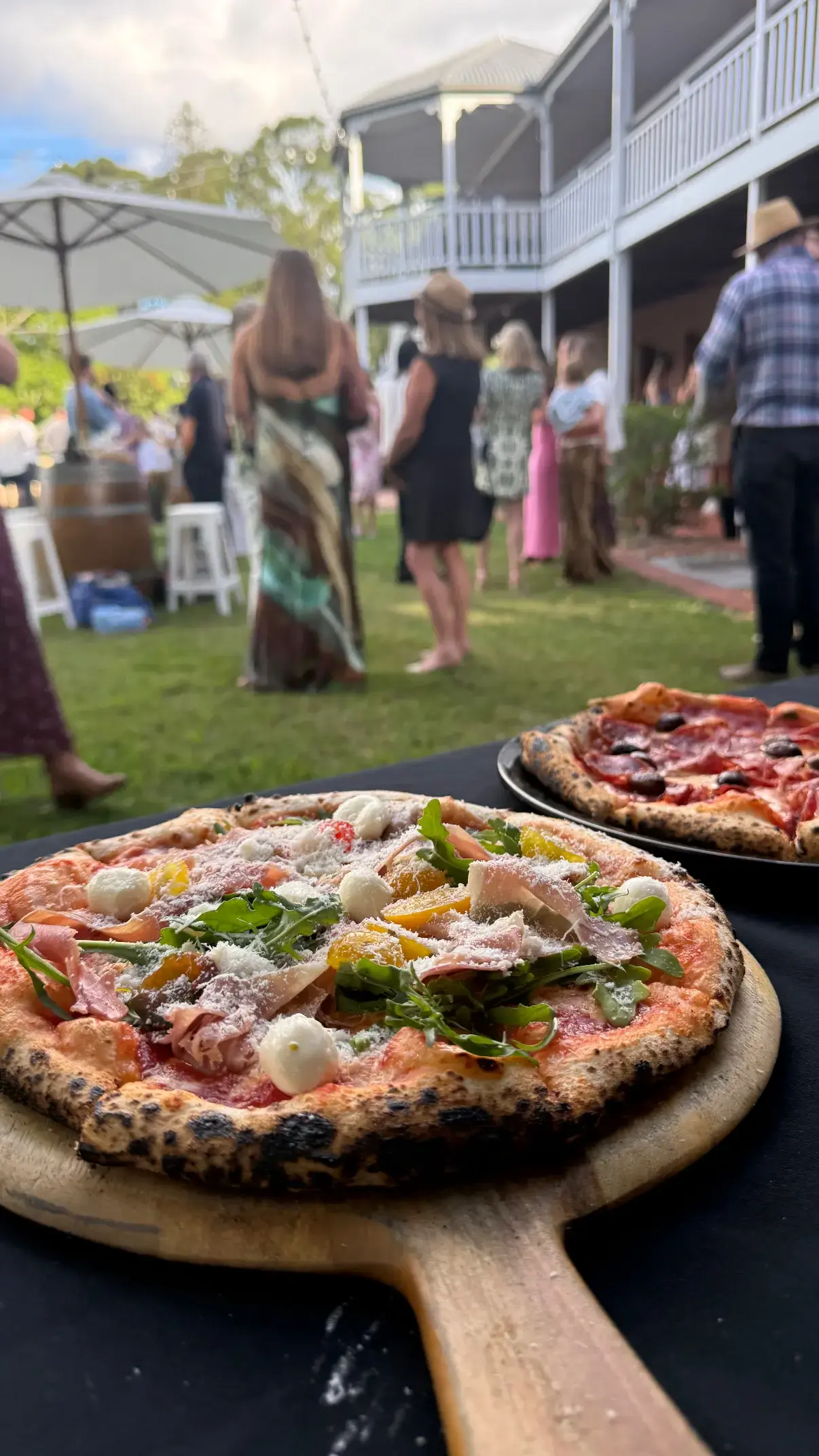 Pizzas cooking inside the woodfired oven
